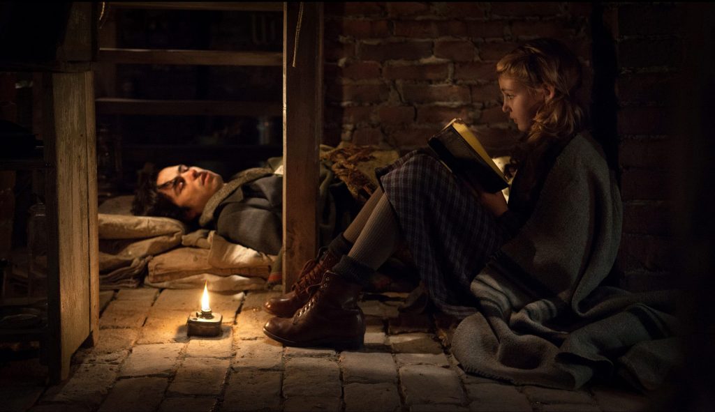This image released by 20th Century Fox shows Ben Schnetzer, left, and Sophie Nélisse in a scene from "The Book Thief," about a girl who loves books. (AP Photo/20th Century Fox, Jules Heath) ORG XMIT: NYET714